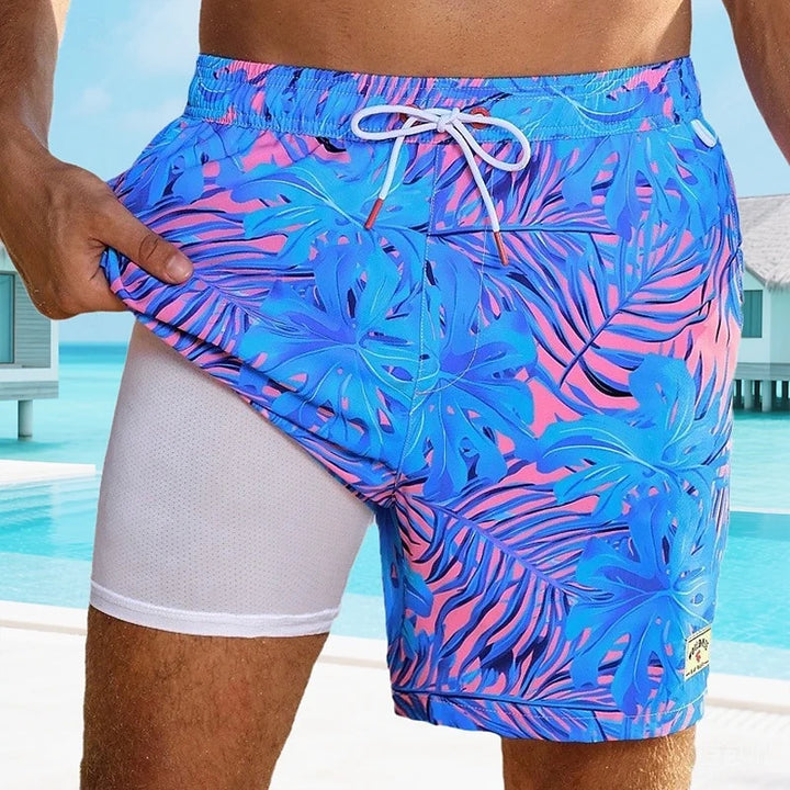 Mannen | Zwemshort met tropische print en zijsplitzoom