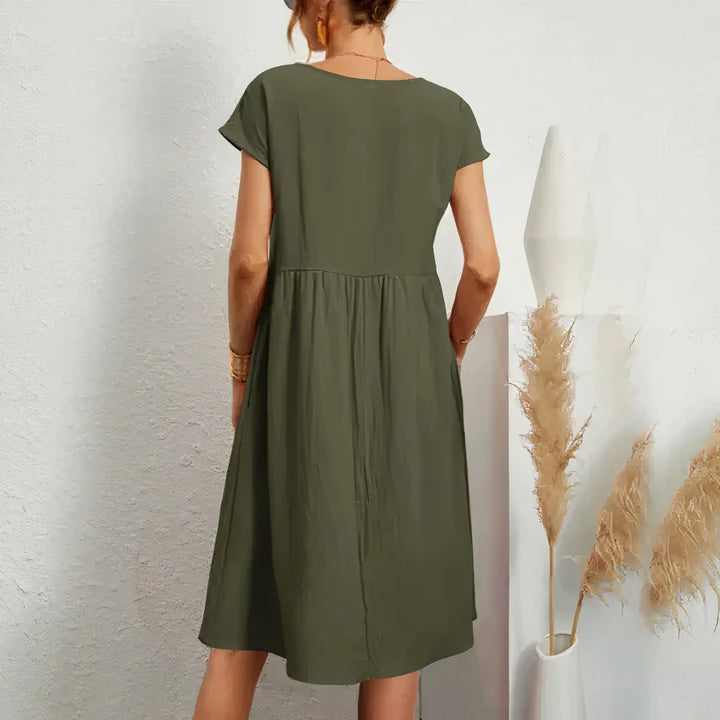 Vrouwen | Knielange jurk met subtiele zakdetails